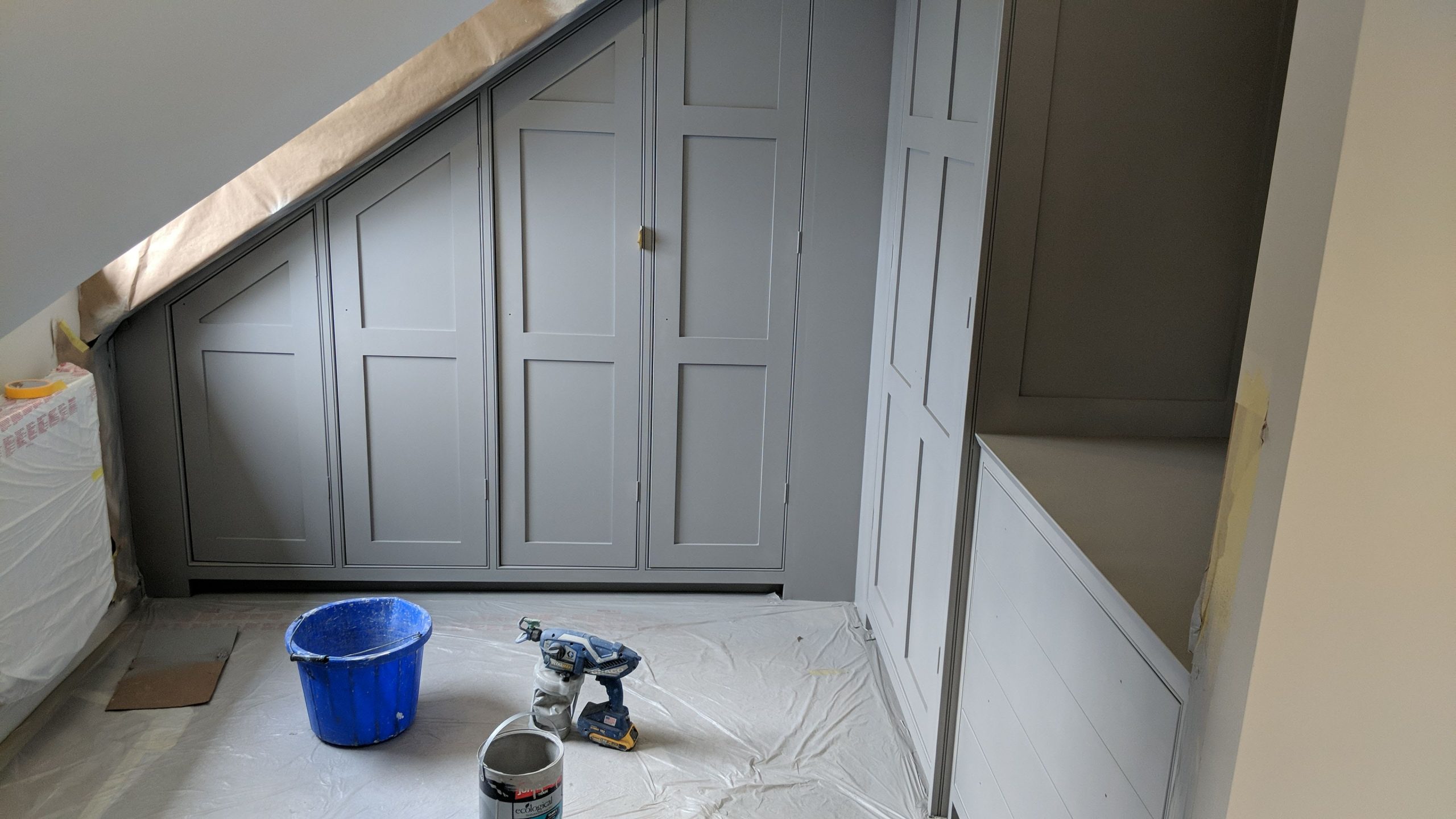 Wardrobes spray painting in water-based paint matched in F&B manor house