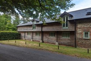 exterior painting on a barn conversion in hampshire Andover windows and doors